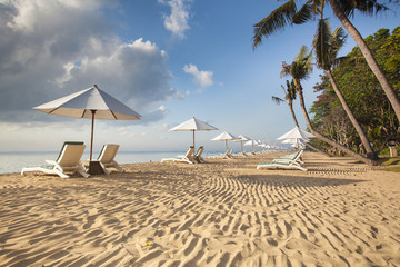 Beds and umbrella on a tropical beach