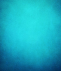 Fototapeta na wymiar abstract blue background or dark paper with bright center spotli