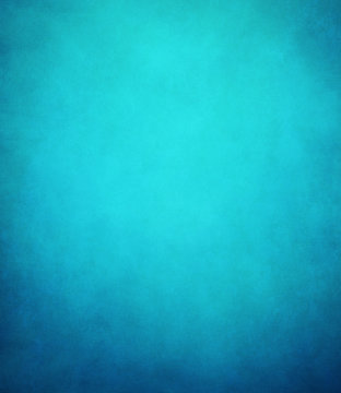 abstract blue background or dark paper with bright center spotli