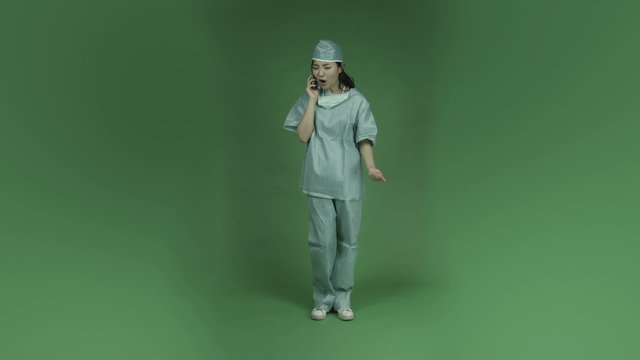 young asian adult woman doctor surgeon isolated on green-screen