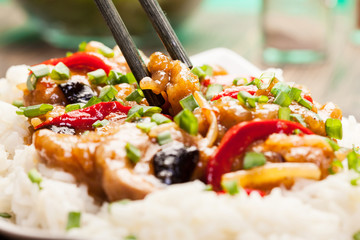 Sirloins on sweet and sour sauce served with rice
