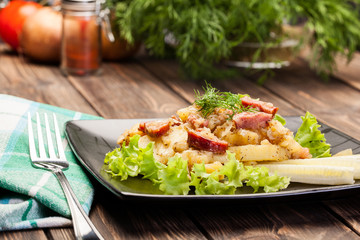 Scalloped potatoes with sausage and bacon