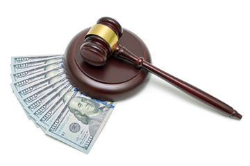 gavel and U.S. dollars on a white background. horizontal photo.