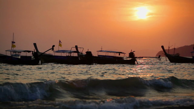 Traditional Thai boats on a sunset, Thailand