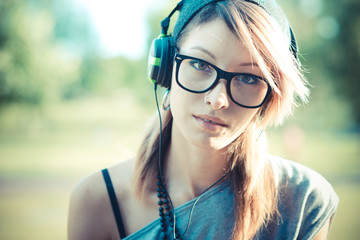 young beautiful model woman listening music