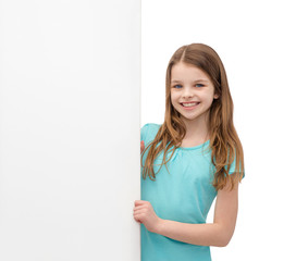 happy little girl with blank white board