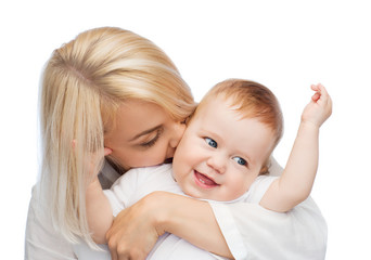 happy mother kissing smiling baby