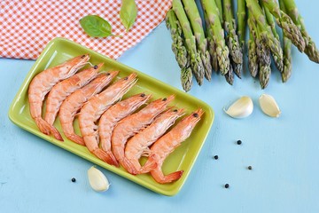 King shrimps in a green rectangular plate