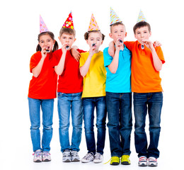 Group of happy children with party blowers.