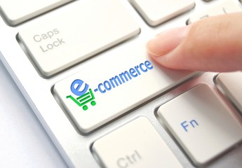 E-Commerce Button on Computer Keyboard. Internet Concept
