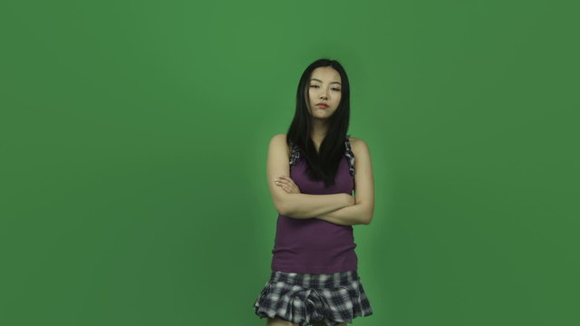 Asian student girl isolated greenscreen green background upset