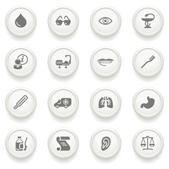 Medicine icons on gray buttons.