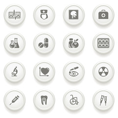 Medicine icons on gray buttons.