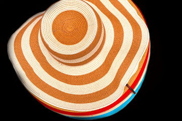 Fototapeta na wymiar Hats are stacked for sale at the market