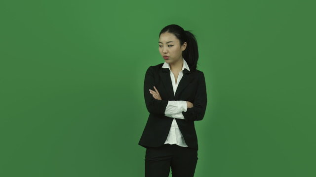 Asian business woman isolated greenscreen green background upset
