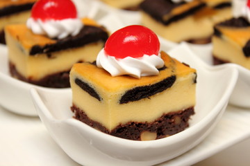 brownie cheese cake on white cup