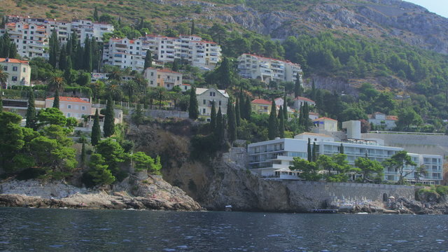 Dubrovnik old town surroundings with rocky beach.