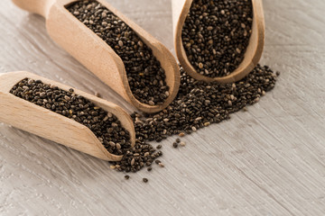 Chia seeds in wooden scoops