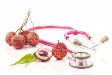 Lychee. Fresh lychees and Doctor's stethoscope.