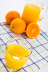 Fresh squeezed orange juice, on kitchen table.