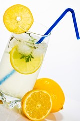 Glass of fresh and cold lemonade, isolated on white background.