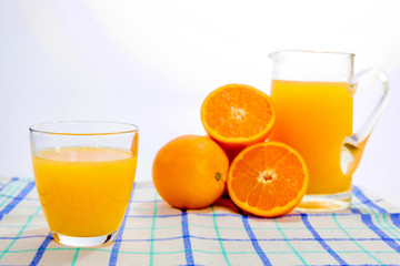 Fresh squeezed orange juice, on kitchen table.