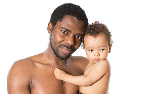 Happy black father and child boy cuddling on isolated