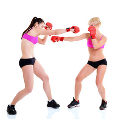 sport training of two boxing young woman, studio over white