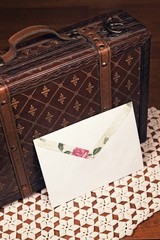 White envelope and leather case.