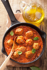 meatballs with tomato sauce in black pan