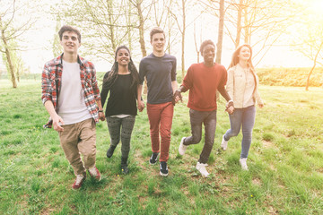 Fototapeta premium Multiethnic Group of Teenagers Walking at Park