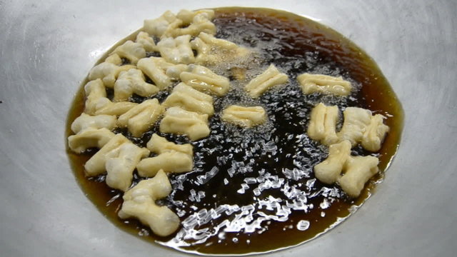 Frying Chinese Donut In Big Pan