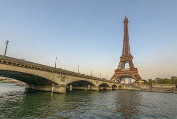 Fototapeta na wymiar Eiffel Tower and Seine River at sunset