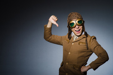Funny pilot with goggles and helmet