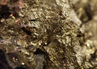 Nugget, gold, bronze, copper, iron. Macro. Extreme closeup