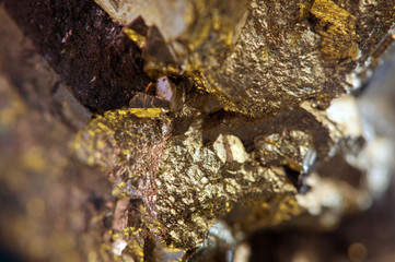 Nugget, gold, bronze, copper, iron. Macro. Extreme closeup