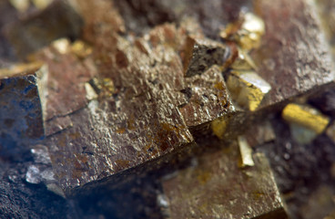 Nugget, gold, bronze, copper, iron. Macro. Extreme closeup