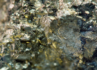 Nugget, gold, bronze, copper, iron. Macro. Extreme closeup