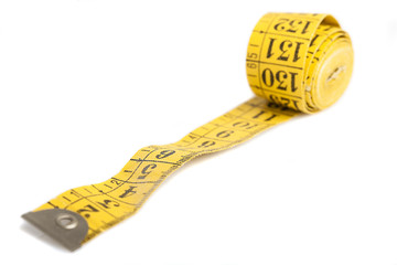yellow measure tape isolated on a white background