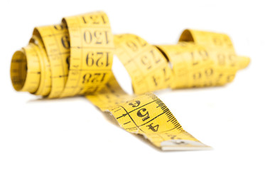 yellow measure tape isolated on a white background