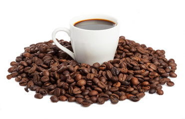 coffee cup and coffee beans isolated on white