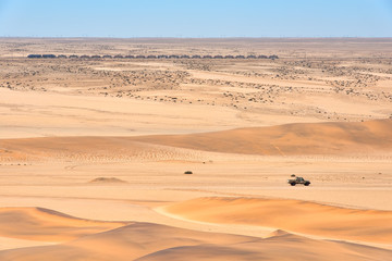 Train and car in the desert in Namibia
