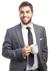portrait of business man holding a tea mug isolated on white