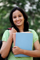 Fototapeta premium Happy young female student at college campus