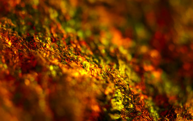 Abstract colour dark background.  Orange crystals. Macro