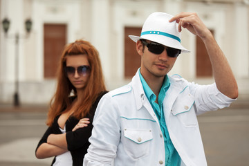 Young fashion couple on the city street