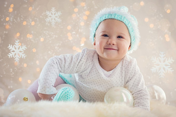 Winter Baby Smiling With Christmas Ornaments