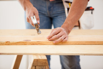 Nailing some wood boards