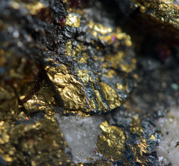 Crystal, gold, bronze, copper, iron. Macro.
