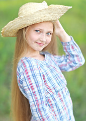 portrait of little girl outdoors in summer